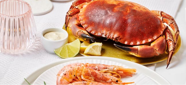 Gambones con aliño cítrico con buey de mar